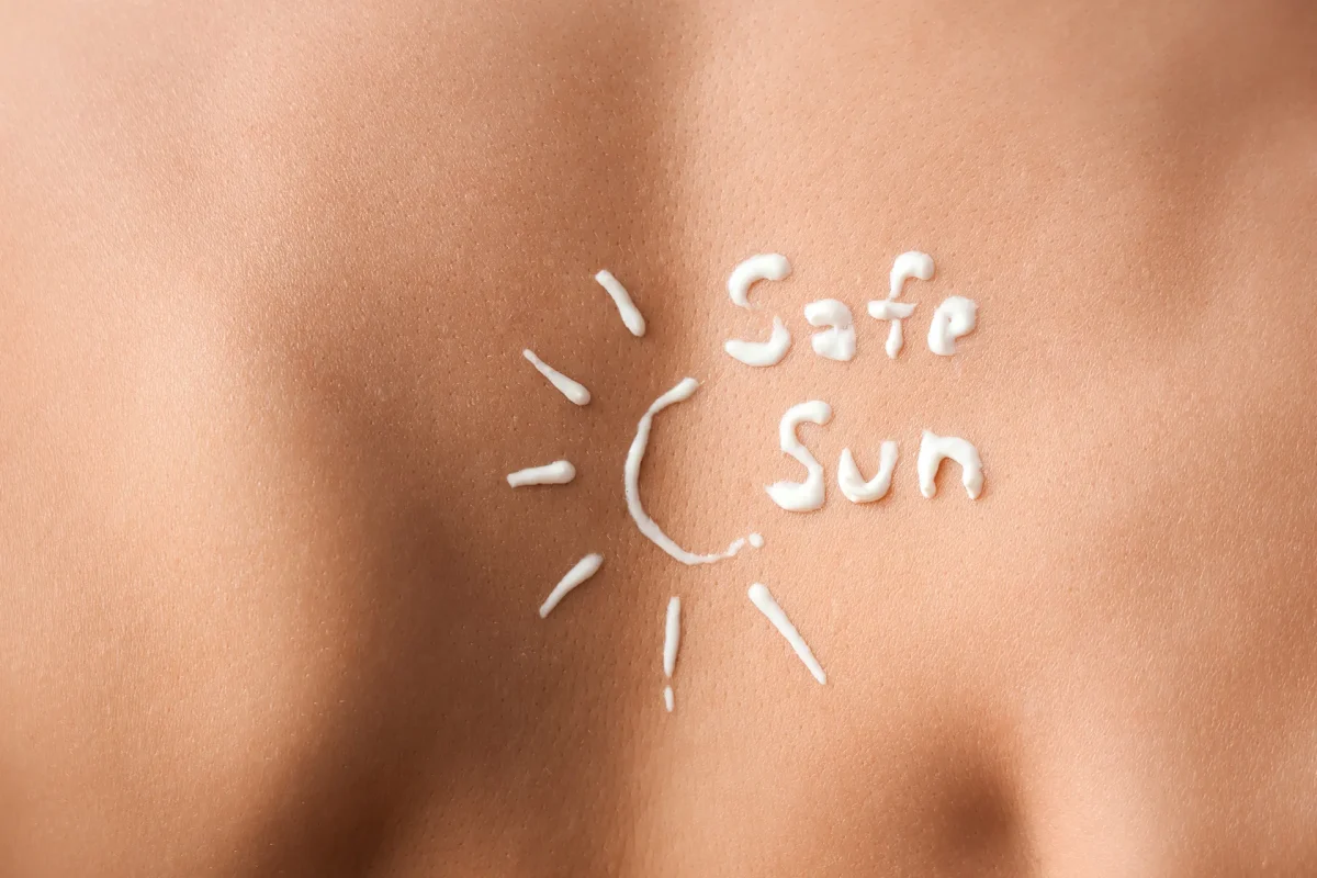 Expert opinion on SPF: sun protection message written with sunscreen on skin