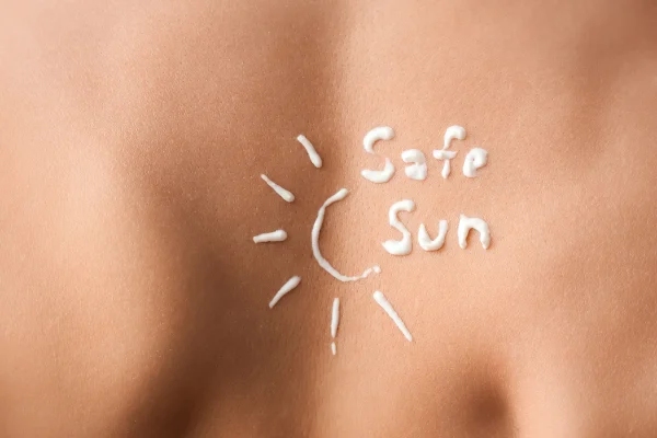 Expert opinion on SPF: sun protection message written with sunscreen on skin